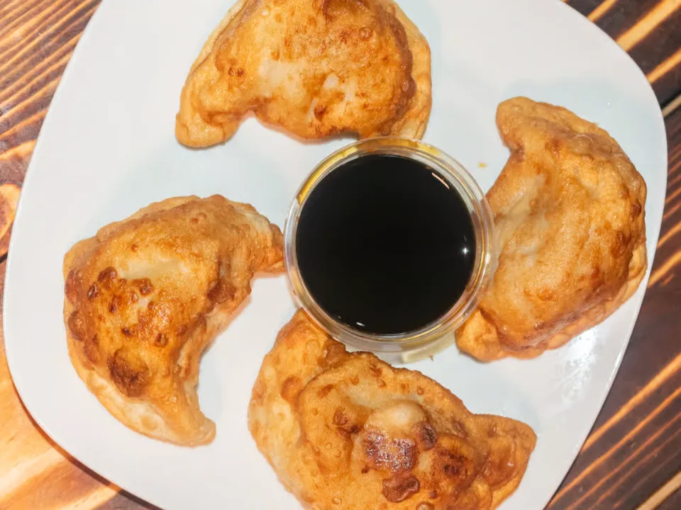 Peking Ravioli - Pan-fried dumplings with savory pork filling